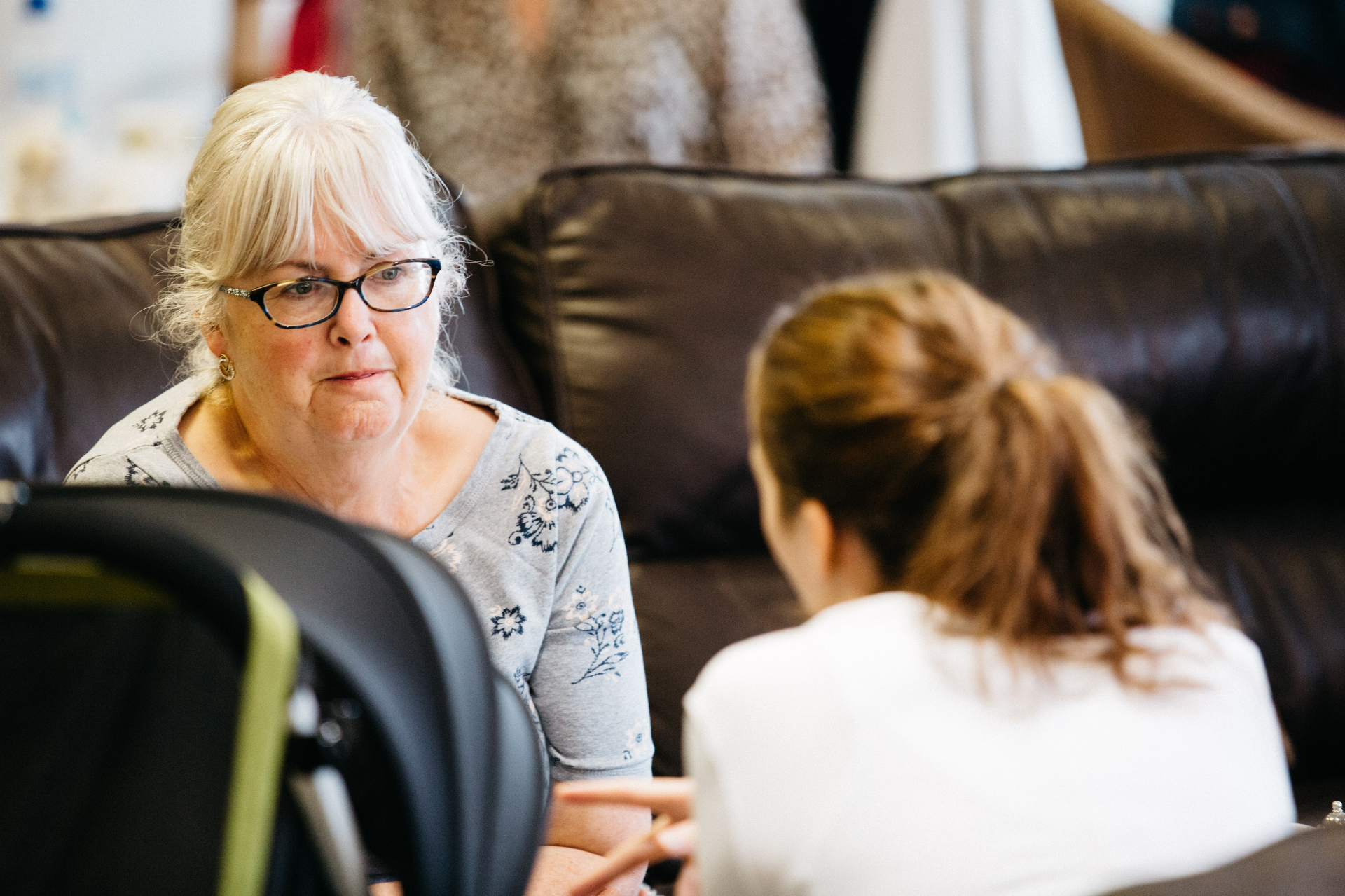 An older woman in conversation with a befriender