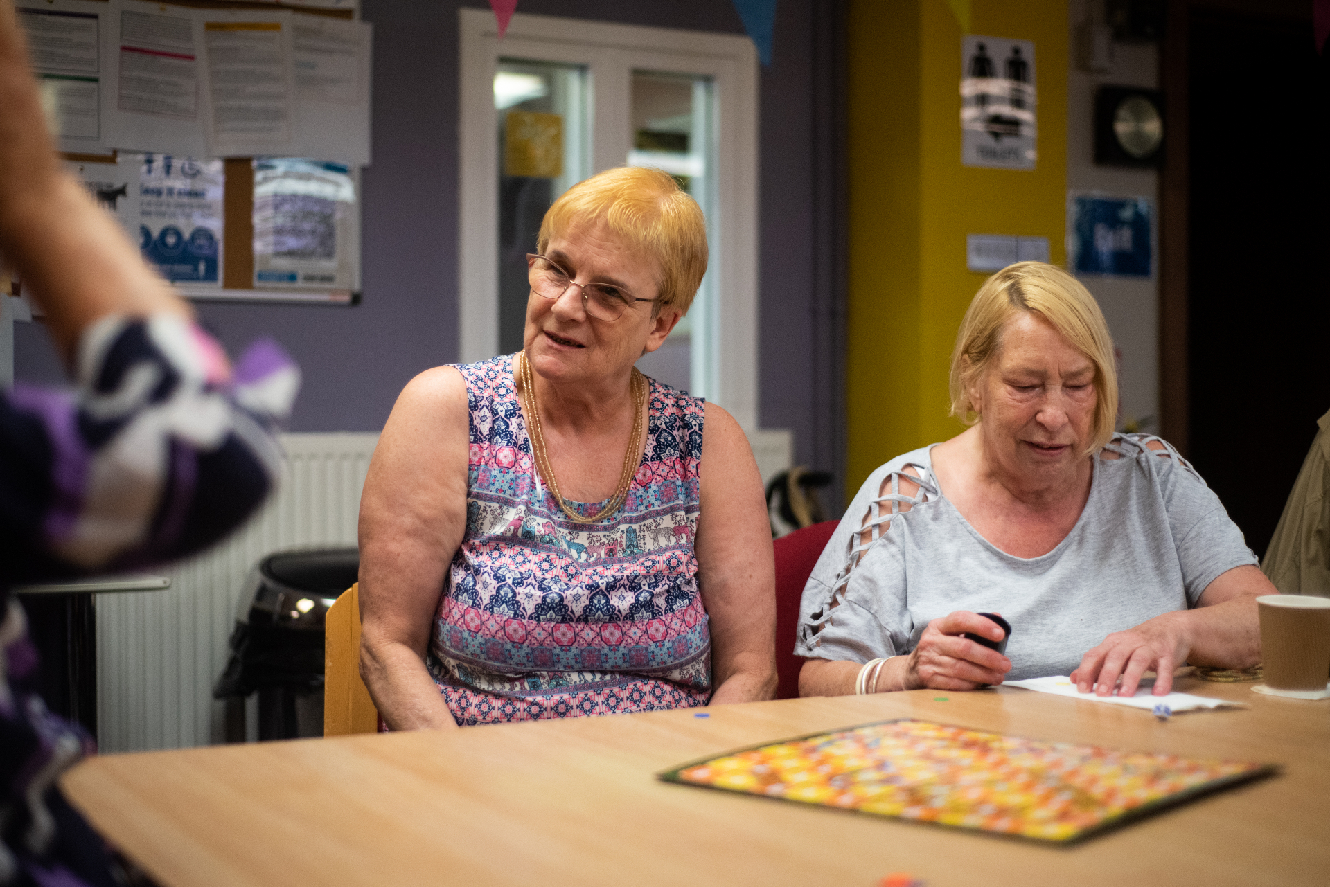 Older women enjoying a group game together