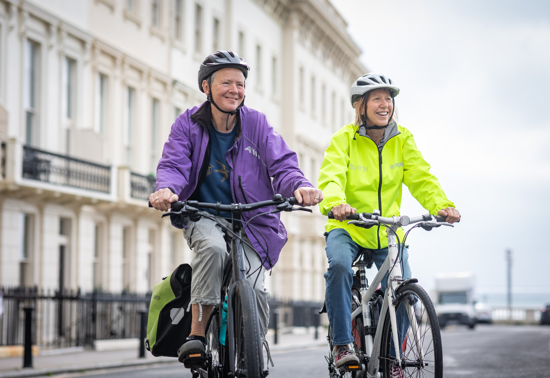 Two women enjoying a community cycling activity