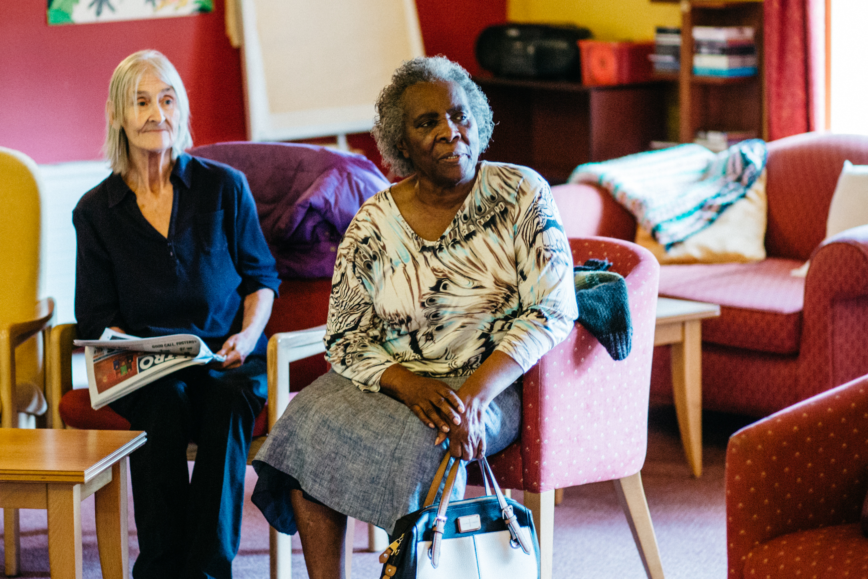 Members relaxing together in a day centre lounge